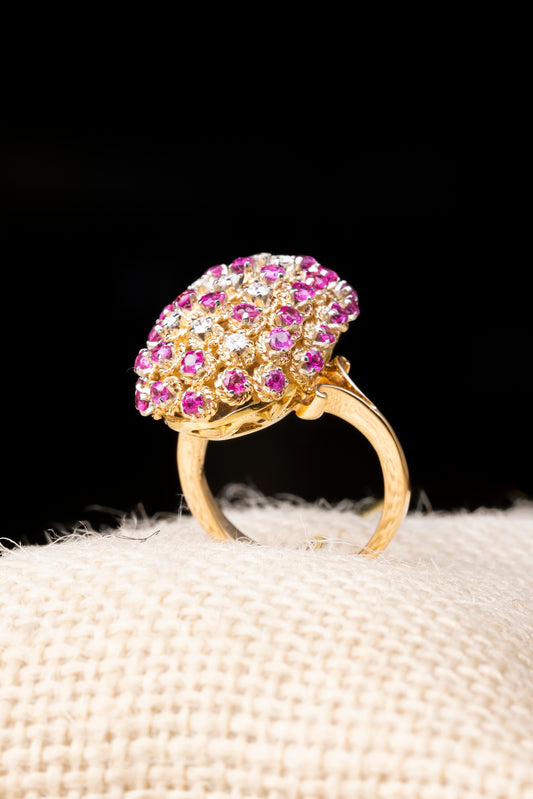 An 18 kt cocktail ring with diamonds and purplish/pink sapphires