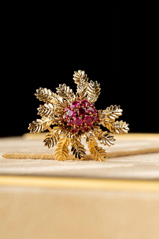 Yellow gold with rubies brooch made by Boucheron